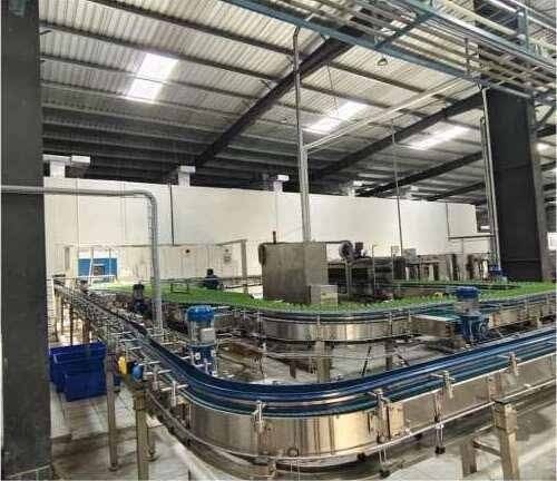 CIP steel process tanks on a commercial production floor